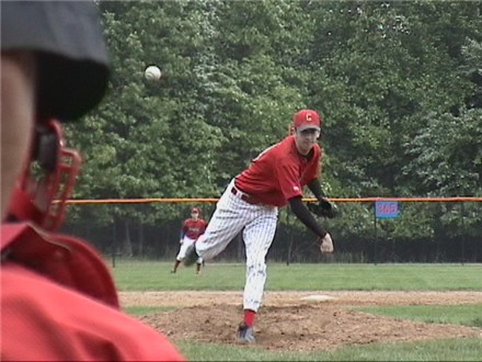 Dan Nicol pitches the first pitch of the regular season
