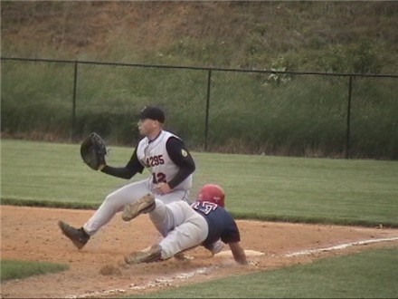 Ant Russell dives in safe at first