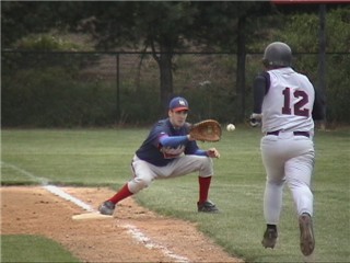 Andy Walther takes the throw from Catcher Matt Berry