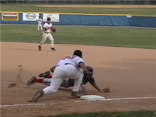 Humm, a balk and a missed the tag in one play...Coach is going ape on this one.