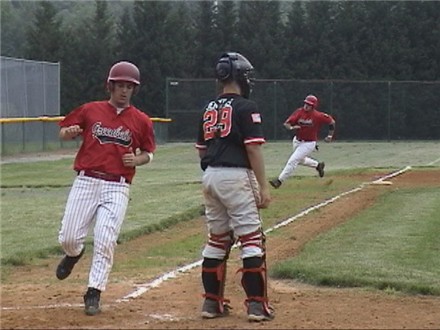 Ant Russell scores and Ryan Reese wheels around third