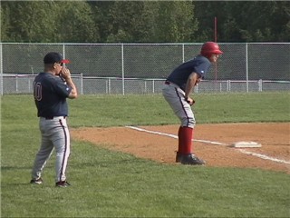 Brett Cecil running the bases.  Coach Prange is yelling at him to get back.