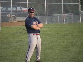 Coach Prange gives the sign to Konis to hit for the fence
