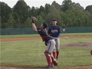 Matt Berry makes the tough catch.  He didn't need the bat or helmet for this one.