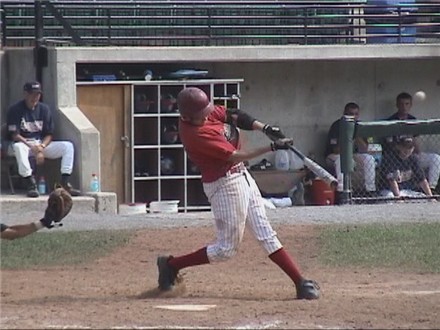 Andy Walther drives a solo shot over the center field wall.