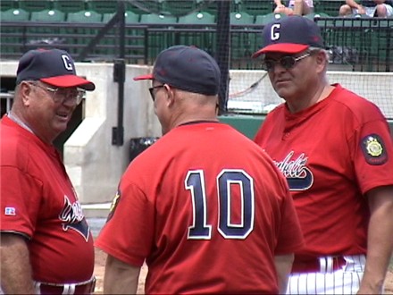 Coach Smith, Prange and Truman enjoy a moment during the game